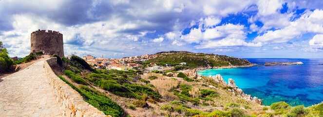 Italy summer holidays. Sardegnia island . village Santa Teresa di Galura in northern part with turquoise sea and defencive old tower 