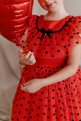 Girl in the red dress.