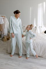 Fototapeta na wymiar parent and child in pijamas