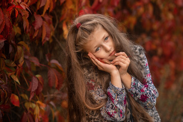 portrait of a girl in autumn park