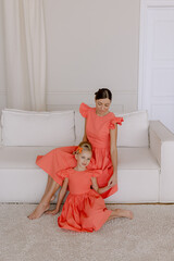 Mom and daughter in dresses