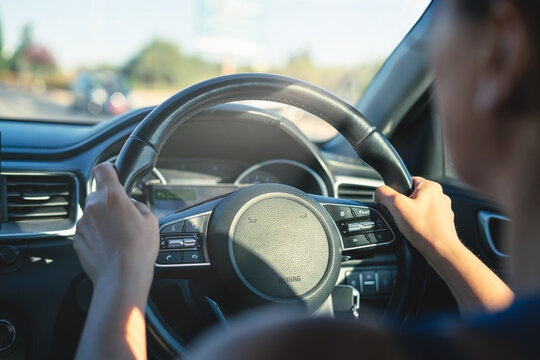 Steering Wheel On The Left Side Of The Car.Woman Drive A Car