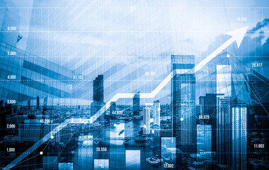 Financial graphs and digital indicators overlap with modernistic urban area, skyscrabber for stock market business concept. Double exposure.
