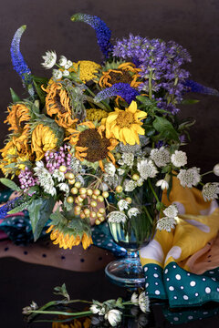 Autumn bouquet of sunflowers in a vase on the table. Lovely bunch of flowers.Soft focus.
