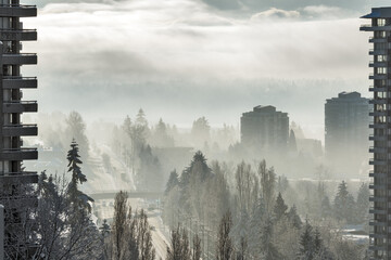 City on foggy winter morning in Canada