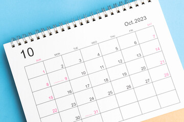 calendar October 2023 top view on a blue background - obrazy, fototapety, plakaty