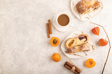 Homemade sweet bun with apricot jam on gray concrete. top view, copy space.