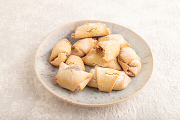 Homemade sweet cookie with apple jam on gray concrete. side view.