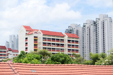 low angle view of signapore residential buildings against blue sky 