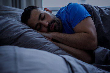 Sleep, insomnia and people, conceptually speechless man lying in bed at home at night