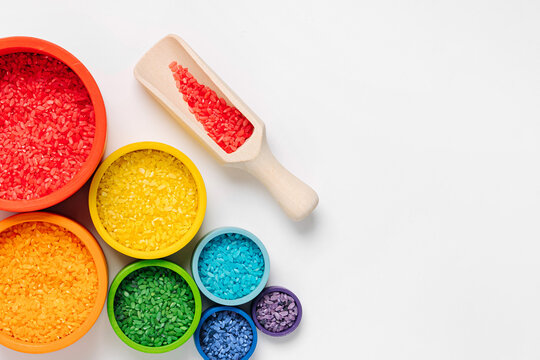 Bowls In Rainbow Colors With Colored Rice And Scoops. Sensory Bin Toddler. Montessori Material. Learning Colors. Scooping And Pouring Activity For Kids. Games For Learning And Development Of  Child