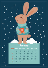 January 2023 calendar. Year of the rabbit, symbol of the new year. The week starts on Sunday. A cute rabbit in a sweater stands and smiles under the snow with a cup of hot drink in its paws.