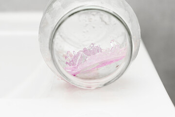 Fototapeta na wymiar Chemical experiment on growing crystals. Crystal grown in a jar.
