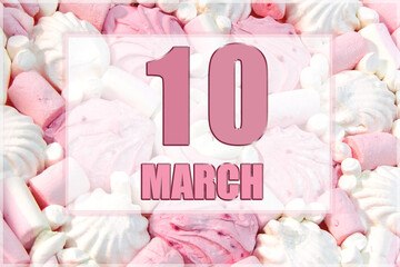 calendar date on the background of white and pink marshmallows. March 10 is the tenth day of the month