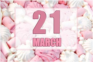 calendar date on the background of white and pink marshmallows. March 21 is the twenty first day of the month