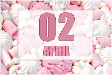calendar date on the background of white and pink marshmallows.  April 2 is the second  day of the month