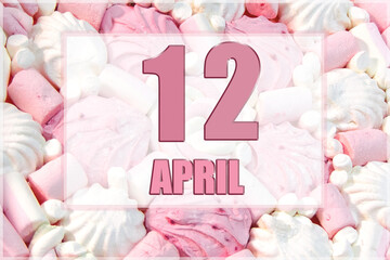 calendar date on the background of white and pink marshmallows. April 12 is the twelfth day of the month