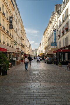 Vertical shot of the famous Rue Cler street in Paris