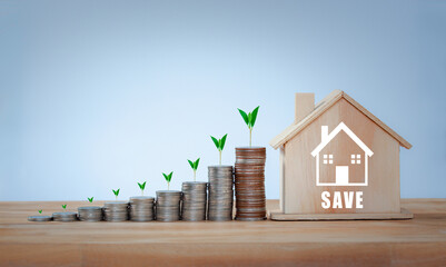 Stack of coins and House model are growing growth currency coin for financial and investment...