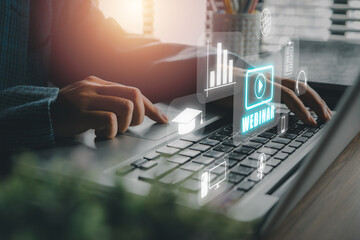 Webinar e-learning training business internet technology concept. Person hand using laptop computer and smart phone with VR screen webinar icon on office desk.