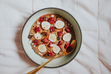 Healthy breakfast oatmeal bowl and fruit