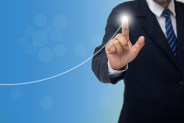 Businessman touching the graph with his finger