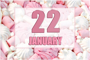 calendar date on the background of white and pink marshmallows. January 22 is the twenty-second day of the month
