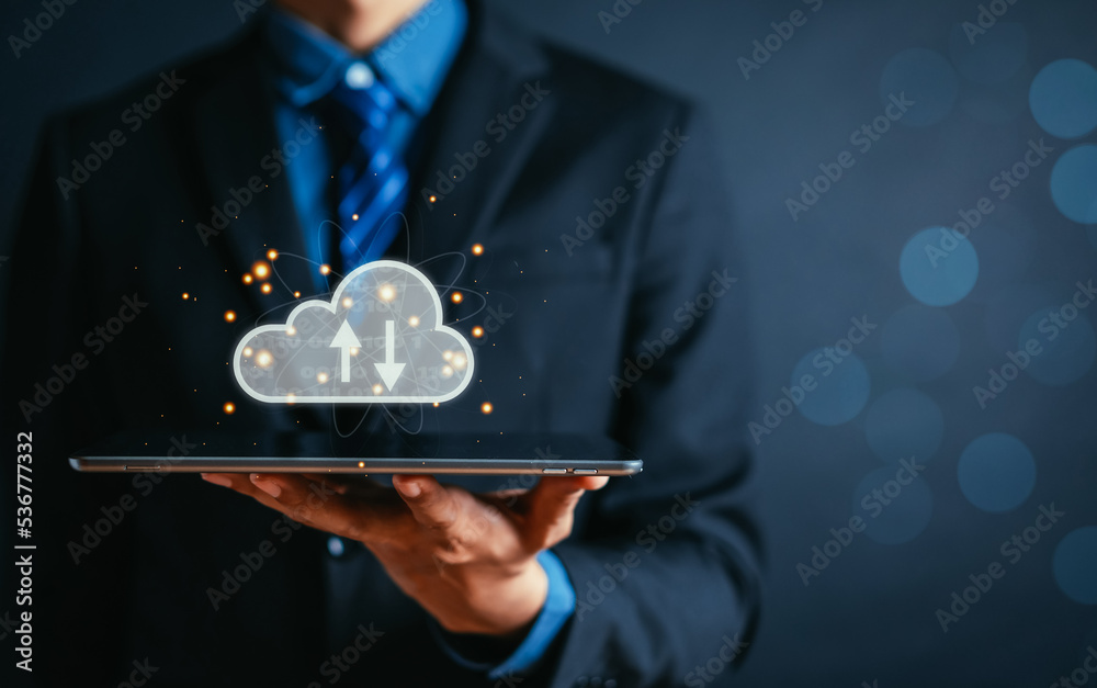 Fototapete Businessman holding tablet using cloud computing to download and loading data information and upload on system network application. Technology transformation concept