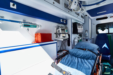 EMS. Interior of ambulance with gurney, defibrillator and other medical equipment and supplies...