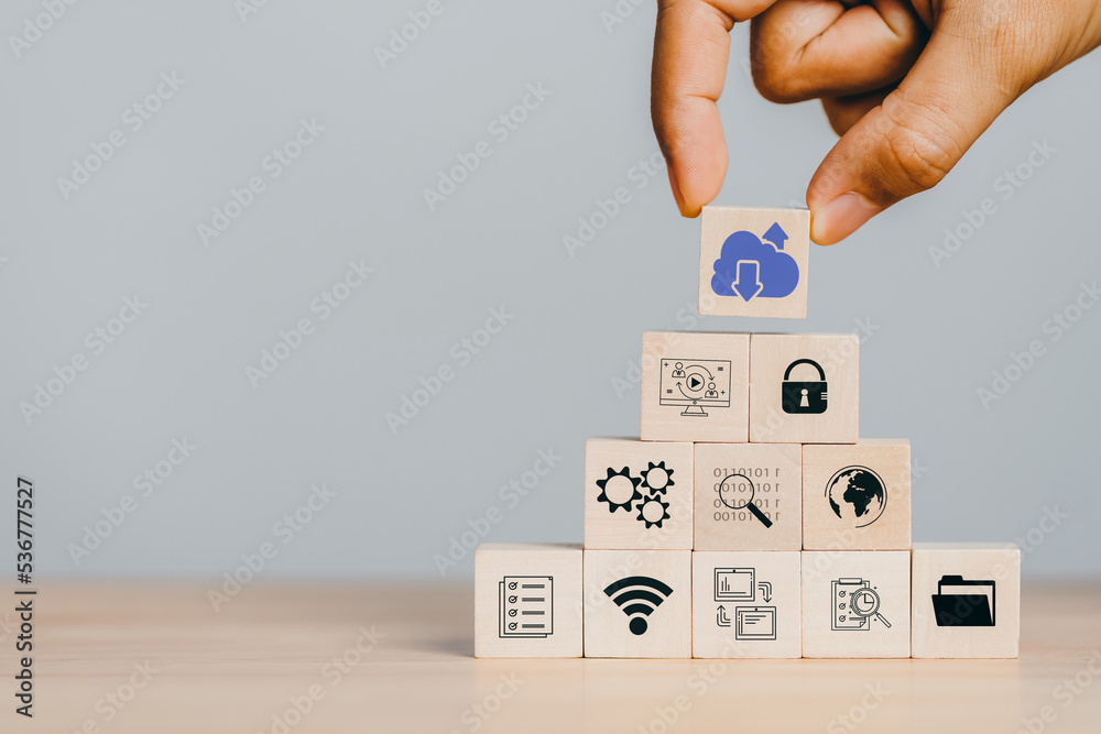 Aufkleber  Cloud computing to download and loading data information and upload on system network application. Technology transformation. Hand holding wooden cube block icon.