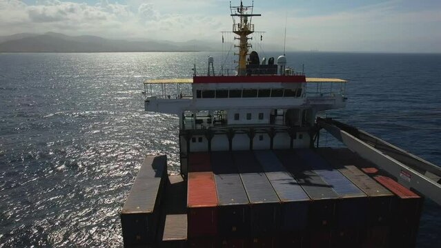 Kingston anchorage, Jamaica - 12.15.2021 Aerial view of navigational bridge of container cargo ship with antennas, navigational lights and satellite equipment