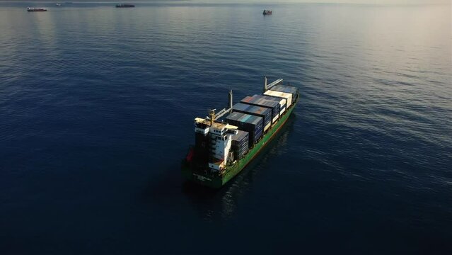 Kingston anchorage, Jamaica - 12.15.2021 Aero view of container ship CMA CGM Ventania at anchorage near Kingston port awaiting for berth during very calm weather