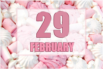 calendar date on the background of white and pink marshmallows. February 29 is the twenty-ninth day of the month