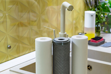 water filter cartridge for home on background kitchen