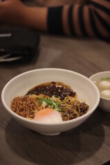 Chili pan mee on the wood table