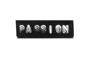 Black color banner that have embossed letter with word passion on white paper background