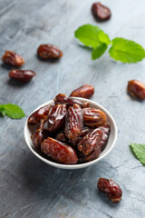 Organic dried Dates fruit in white bowl