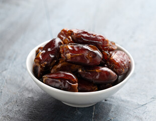 Organic dried Dates fruit in white bowl