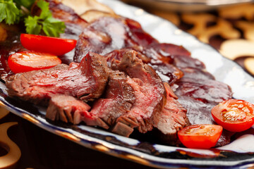 Raw-cured meat in a plate.