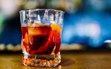 Cocktail Negroni with gin, campari martini rosso and orange. negroni cocktail at the bar