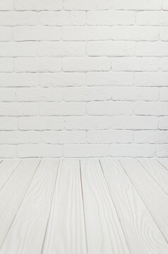 White brick wall, texture boards floor. Background, template, blank for advertising space for text. blurred foreground, selective, focus