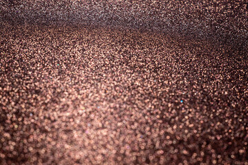 Brown bright abstract bokeh background. Sparkle texture for birthday card, new year, christmas, party and other holidays invitation backdrop.