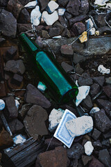 A bottle on stones - obrazy, fototapety, plakaty