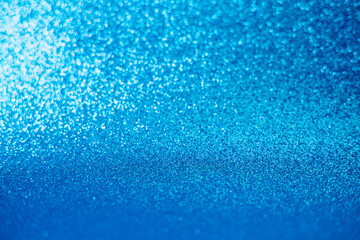 Fototapeta premium Blue sparkle glitter abstract background.