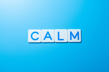Word CALM over a blue background,CALM Concept