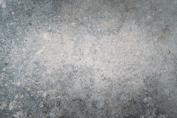 Stony background. Gray concrete. Scratched surface. Grunge aged texture with damages and cracks...