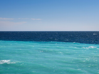 The two-tone Mediterranean Sea. The traditional blue and the turquoise blue.