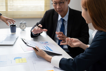 Administrator business man financial inspector and secretary making report calculating balance. Internal Revenue Service checking document.