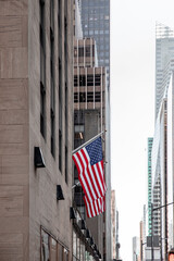 American flag on buildings background