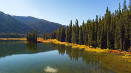 Idaho mountain lake shoreline with autumn colored brush